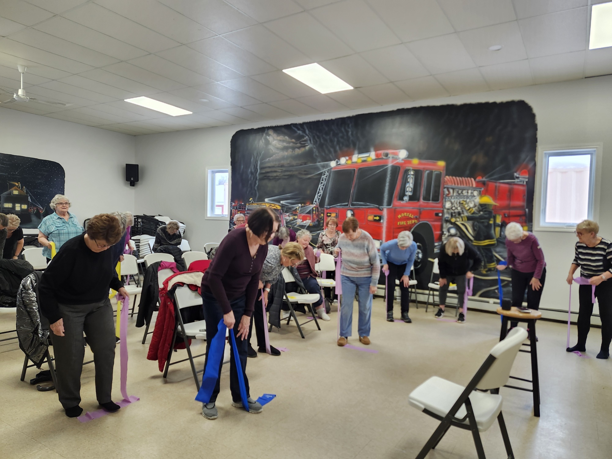Taking Care of Ageing Program partaking in exercise band physical activity